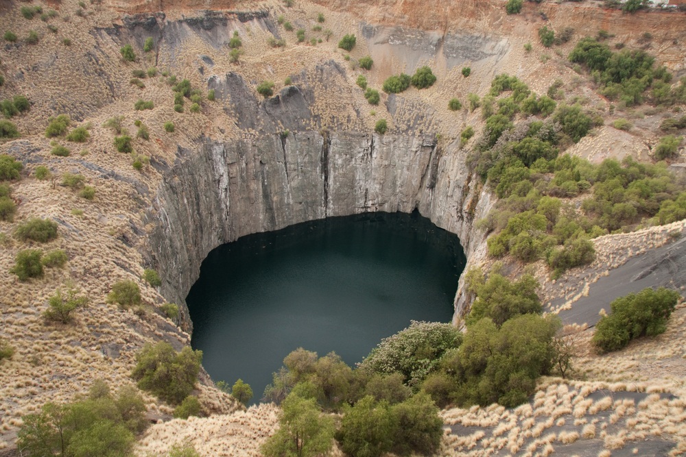 This abandoned diamond mine in South Africa is said to be the biggest man-made hole on Earth. After diamonds were first discovered here in 1869, thousands of miners came to dig in the rock with picks and shovels. Working conditions were brutal, and many miners died in the quest for precious stones. Over 6,000 pounds of diamonds were ultimately removed—enough to make about 14 million diamond rings. (Daleen Loest/ Shutterstock)