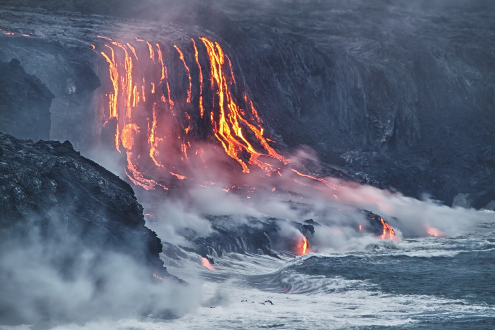 In recent years, the flowing lava from Kilauea volcano in Hawaii has destroyed 180 houses and 8 miles of highway—while adding 500 acres of rocky new shoreline to the island. (Alexey Kamenskiy/ Shutterstock)