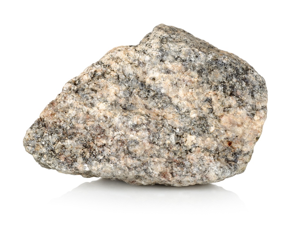 At least three types of mineral crystals are visible in this granite rock: the white, gray, and pink crystals are a mixture of quartz and feldspar, while the black is biotite. Granite is the primary basement bedrock of all the continents. (Givaga/ Shutterstock)