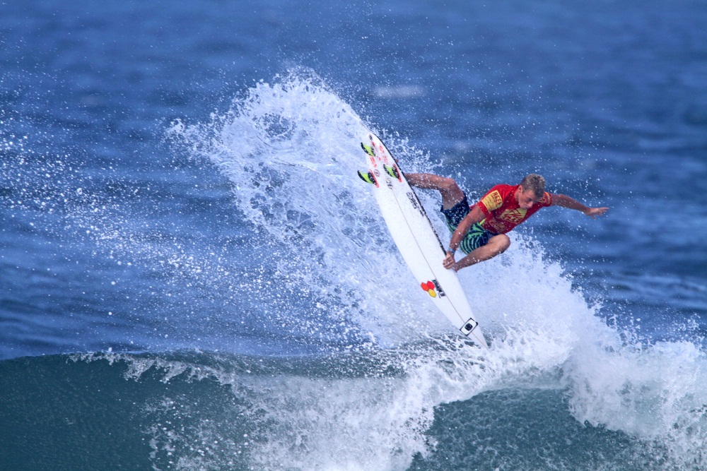 Pro surfer Sebastian Zietz grew up riding monster waves in Hawaii. In 2012, he won the Vans Triple Crown of Surfing at age 24, with a mix of aerials and powerful frontside carves. (Mana Photo/ Shutterstock)