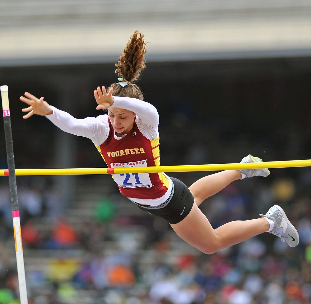 Pole vaulting is the highest flying of the track and field sports. Athletes choose the height of the bar and then get three chances to vault over without knocking it down. Technique and timing are everything. Competitors sprint down a track, plant the pole, and then swing up. At that point, the athlete is hanging on the pole upside down, but there’s so much forward momentum that she can launch upward and flip her body over the bar (hopefully). A soft mat on the other side breaks her fall. The world record for pole vaulting is over 19 feet. (Aspen Photo/ Shutterstock)