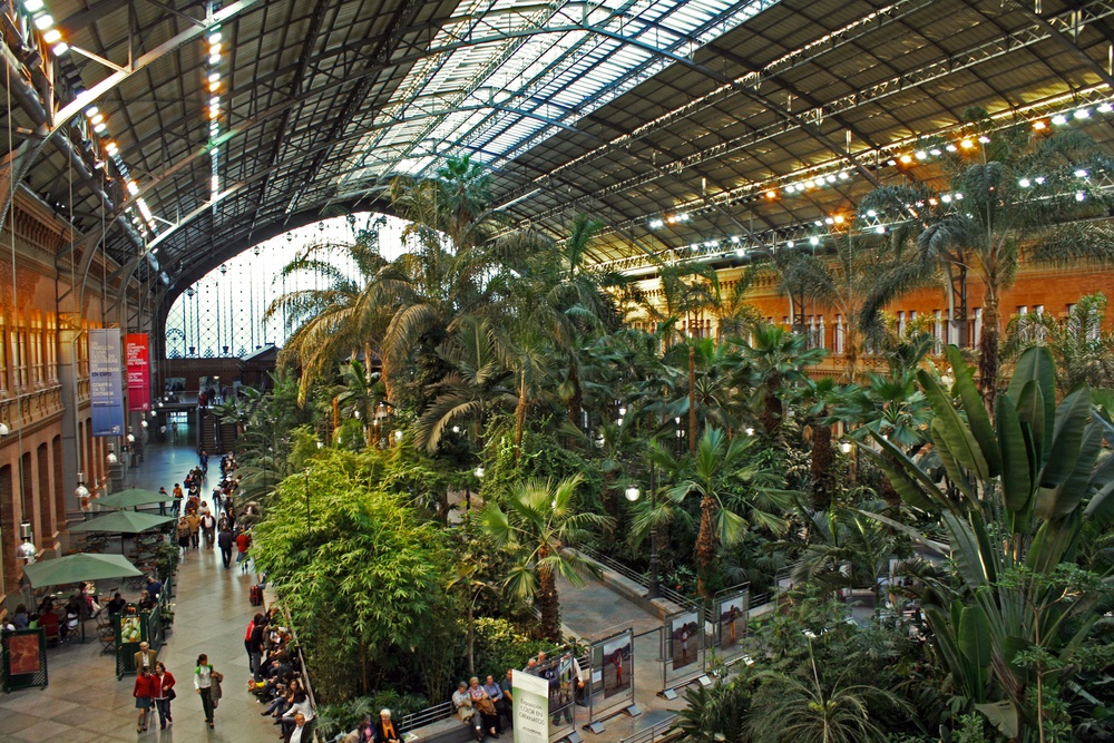 One year older than King’s Cross, the Atocha Train Station in Madrid, Spain, is where subway lines and high-speed rail meet. This part of the station has been turned into a dining concourse with a tropical greenhouse. (dejan83/ Shutterstock)