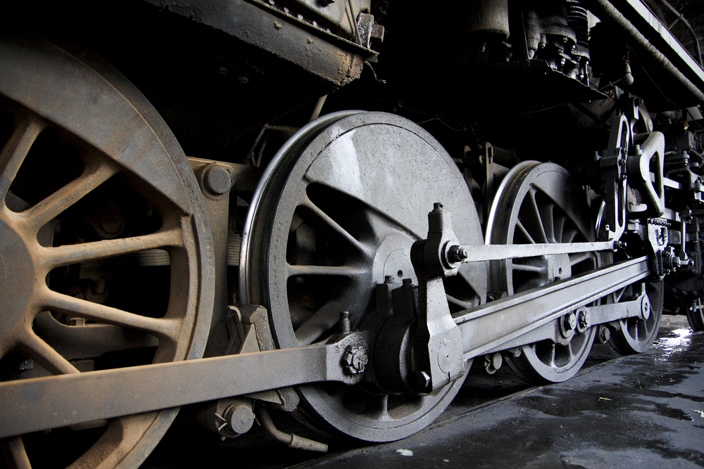 A wide edge on the inside rim of each wheel (called a “flange”) prevents the train from jumping off the tracks. The rods connecting the wheels are pushed back and forth by the engine. That turns the wheels and makes the train go. (Chen.Z/ Shutterstock)