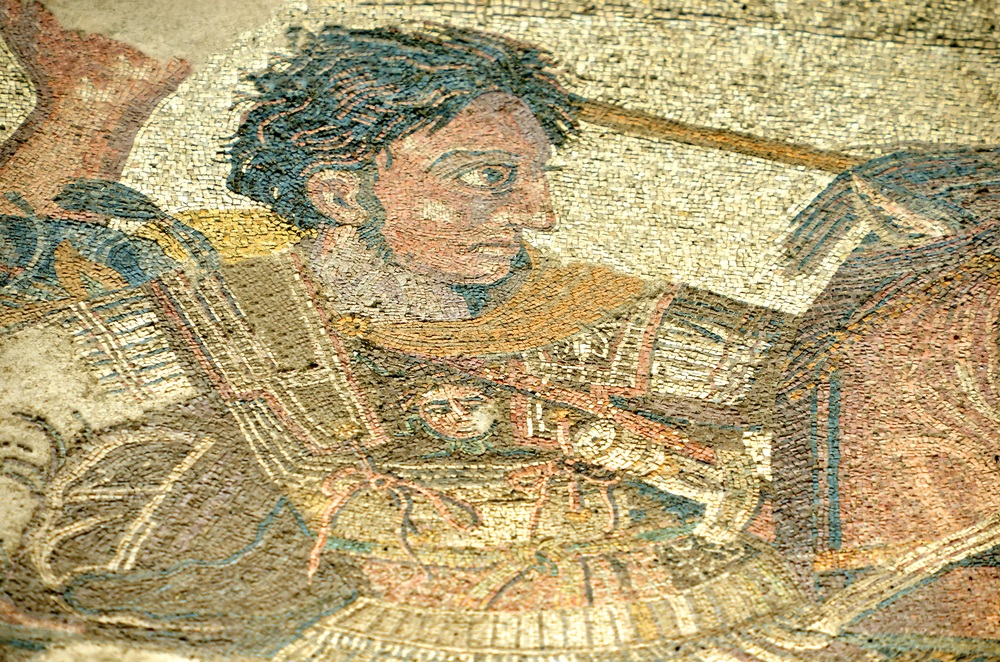 A section of an ancient mosaic found buried in the city of Pompeii shows Alexander the Great waging battle against Darius III, the Archaemenid emperor. On Alexander’s armor, there is a medallion made of gold, picturing Medusa, the mythical Greek monster who had snakes for hair and could turn men to stone if they looked in her eyes.  (mountainpix/ Shutterstock) 