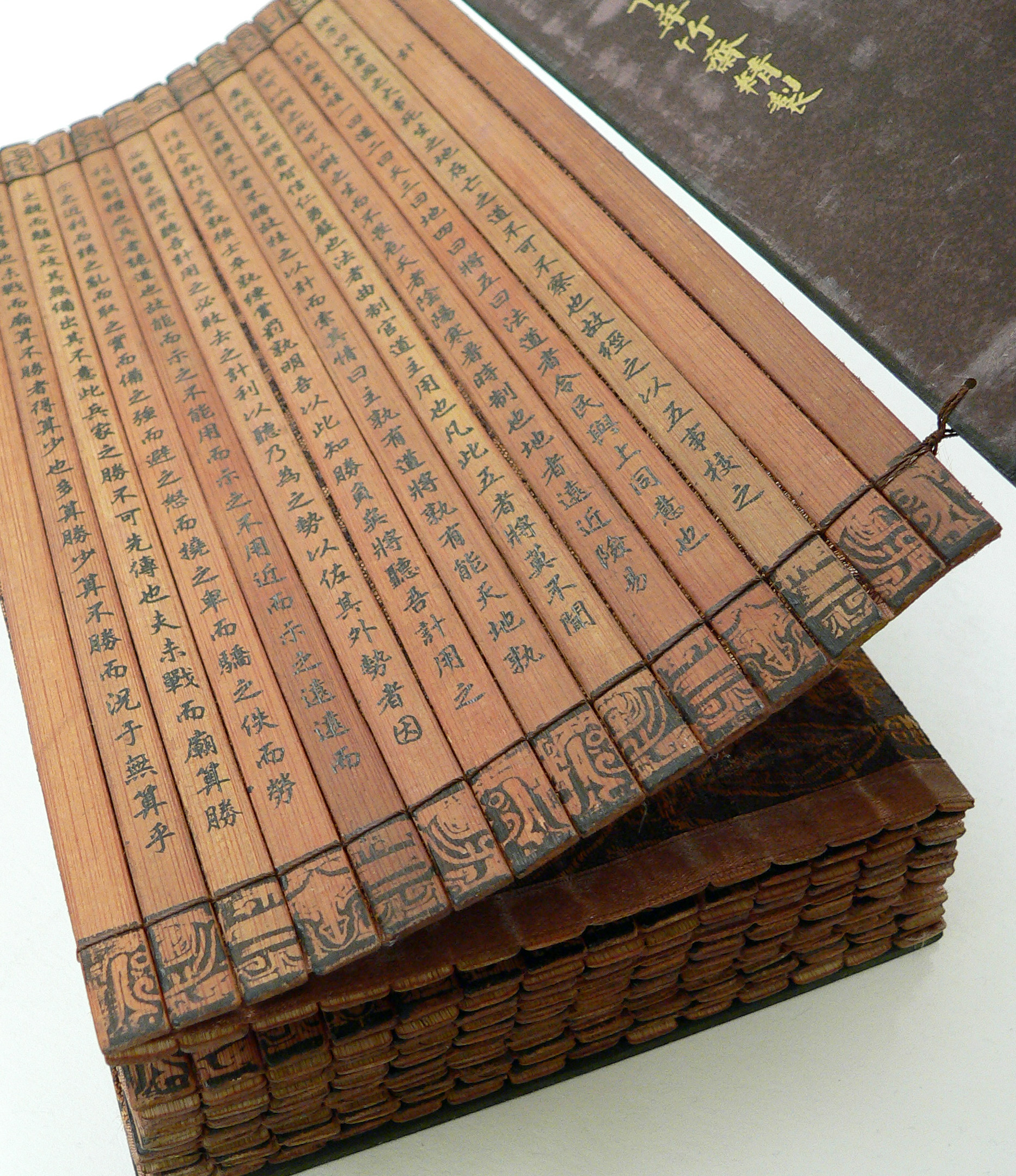 The “Art of War” by Sun Tzu was typically written on vertical slips of bamboo. Each slip offered a piece of advice, such as, “No nation ever benefited from a prolonged war” and “Let your plans be dark and impenetrable as night, and when you move, fall like a thunderbolt.” This copy is part of a collection at the University of Riverside, California. (Photo via Wikipedia) 