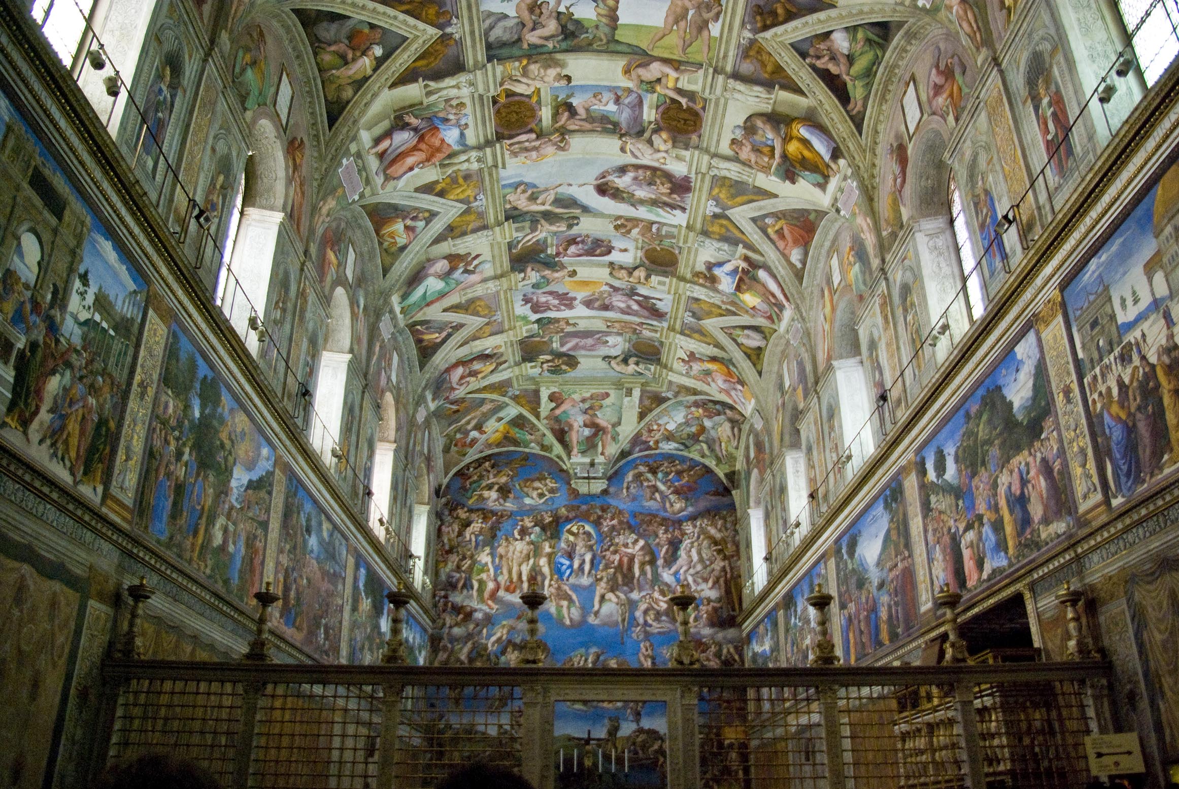 The ceiling of the Sistine Chapel was completed by Michelangelo in 1512. At a time before there were movies or even photographs, seeing these multidimensional scenes high above must have been overwhelming and even otherworldly. The far wall shows Michelangelo’s The Last Judgment, completed many years later in 1541. Frescoes along the other walls are by various Renaissance artists. (Image via Wikimedia Commons)