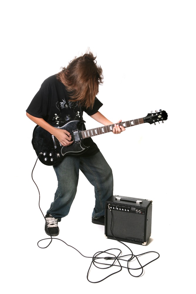 Electric guitars don’t sound like much when they’re unplugged. Instead of sound boxes, electric guitars have “pickups” which transform the strings’ vibrations into electrical signals that can be played and amplified through a speaker. (tobkatrina/ Shutterstock) 