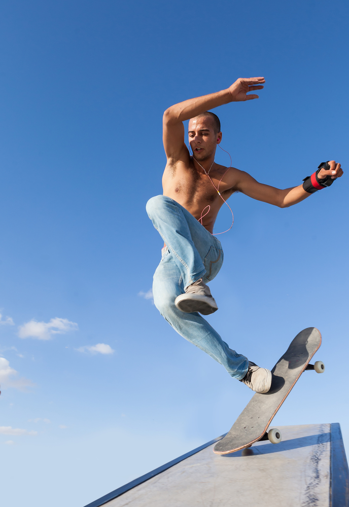 Inertia in action: The front wheel of this skateboard hits an obstacle and stops suddenly, but the rider keeps moving. (Shutterstock / Oleksandr Lysenko)