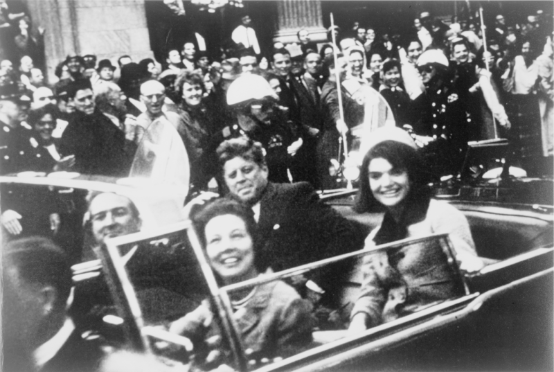 JFK and Jackie Kennedy ride in the presidential motorcade through the streets of Dallas on the day of JFK’s assassination. Governor Connally, who was riding in the front seat with his wife Nellie,was also seriously wounded, but he survived his injuries. (Victor Hugo King / Library of Congress)