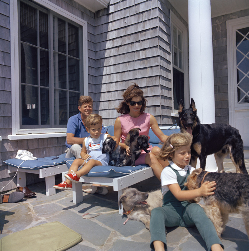 JFK and Jackie Kennedy relax in Hyannis Port in Massachusetts with Caroline and John Jr., and their many dogs. (Cecil Stoughton / John F. Kennedy Presidential Library and Museum)