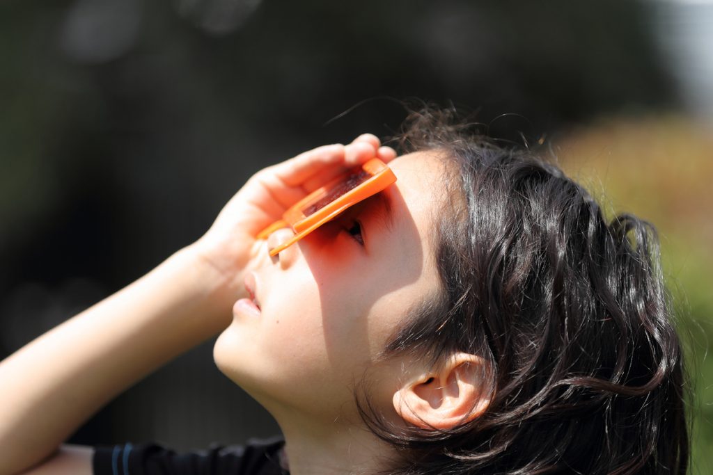 Before you put on your special viewing glasses, learn about the history and science behind the 2017 solar eclipse! (Image by Warioman/iStock)